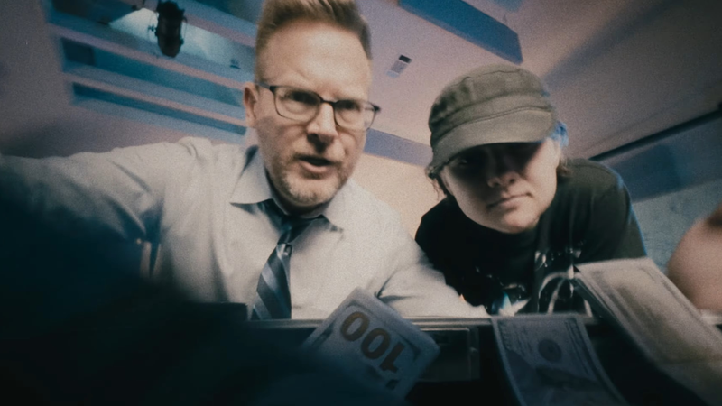 Brian and Penny looking into a cash box