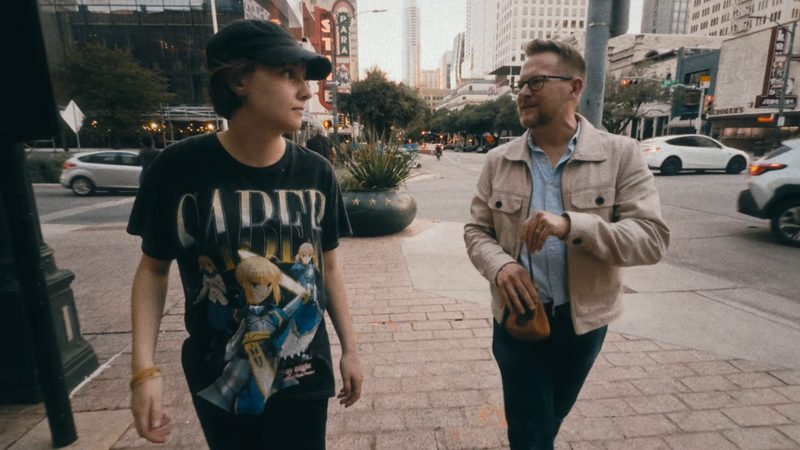 Brian and Penny walking and talking in the city