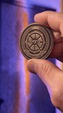 Focus shifts between the original Founders Club challenge coin and the historical plaque. Plaque and name inscription are not included.
