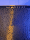 Founders Club commemorative plaque shown for historical context. Plaque and name inscription are not included with this coin.